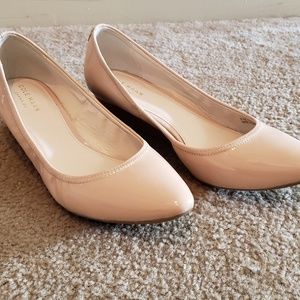 Nude pointed-toe low wedge dress shoe